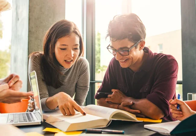 Two students discussing a project